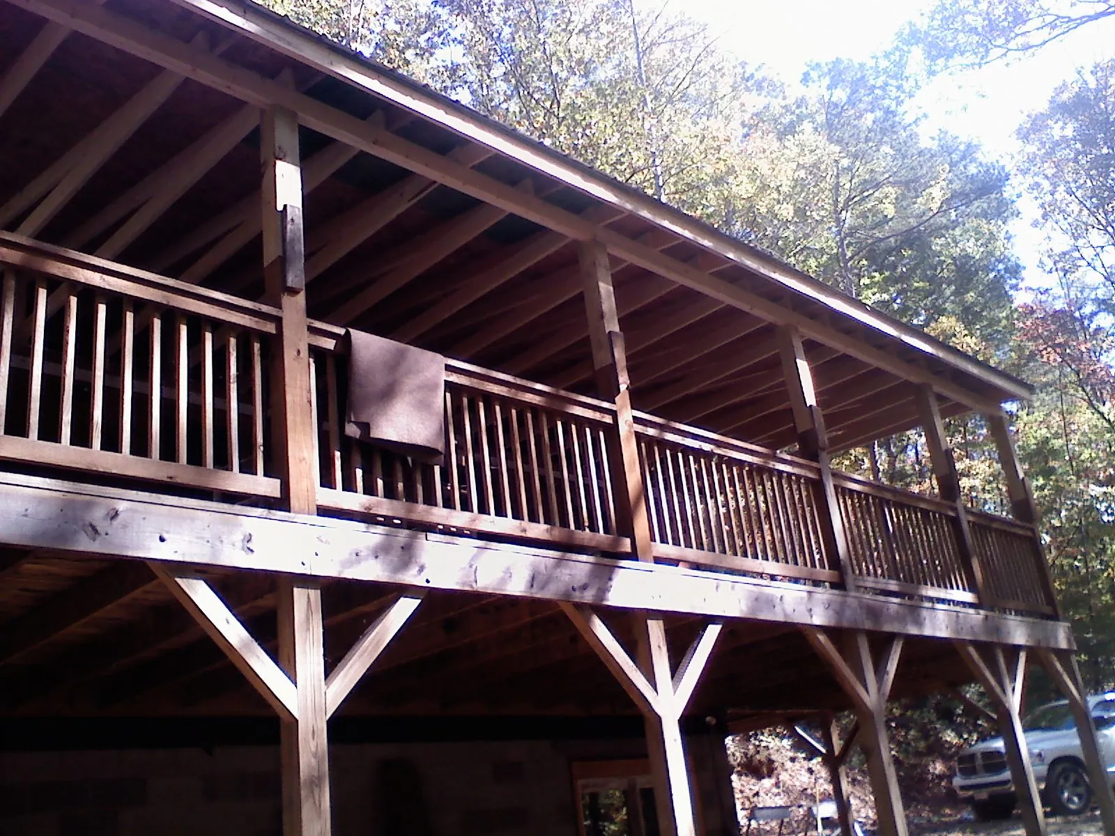 Timber framing under a new elevated porch and deck — Roof Leak Repair in Lena by Roofing Brothers